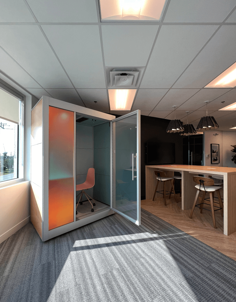 Link Pod in Fractal Workspace: Modern phone booth in co-working open office, featuring sleek design with premium finishes for a stylish and functional workspace.